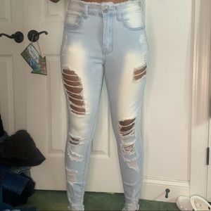 Distressed light blue jeans